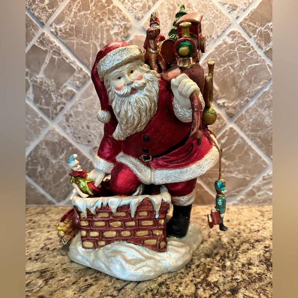 RAZ Imports Santa holding toy bag Holiday